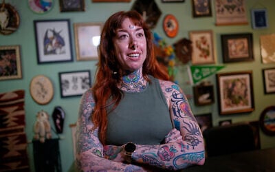 Tattoo artist Mischa Ostberg talks with a visitor at the Ghost Rose Tattoo parlor, November 3, 2025, in Ellsworth, Maine. (AP Photo/Robert F. Bukaty) Tattoo artist Mischa Ostberg talks with a visitor at the Ghost Rose Tattoo parlor, November 3, 2025, in Ellsworth, Maine. (AP Photo/Robert F. Bukaty)