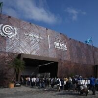 Attendees line up to get into the COP30 UN Climate Summit in Belem, Brazil, November 10, 2025. (AP Photo/Fernando Llano)