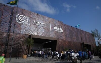 Attendees line up to get into the COP30 UN Climate Summit in Belem, Brazil, November 10, 2025. (AP Photo/Fernando Llano)