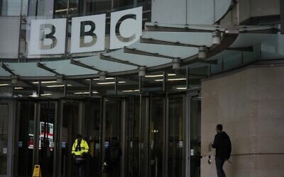 A person walks outside BBC headquarters in London, November 10, 2025. (AP/Kin Cheung)