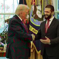 In this photo released by Syrian Presidency press office, US President Donald Trump, left, shakes hands with Syria's President Ahmad al-Sharaa, at the White House in Washington, November 10, 2025. (Syrian Presidency press office via AP)