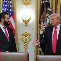 In this photo released by the Syrian Presidency press office, US President Donald Trump, right, speaks with Syria's President Ahmad al-Sharaa, at the White House in Washington, Nov. 10, 2025. (Syrian Presidency press office via AP)