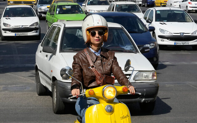 Merat Behnam drives her motorbike in downtown Tehran, Iran, November 1, 2025. (AP Photo/Vahid Salemi) Merat Behnam drives her motorbike in downtown Tehran, Iran, November 1, 2025. (AP Photo/Vahid Salemi)