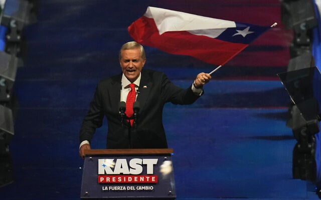 Presidential candidate Jose Antonio Kast of the Republican Party waves a flag during a campaign rally ahead of general elections, in Santiago, Chile, Nov. 11, 2025. (AP Photo/Esteban Felix) Presidential candidate Jose Antonio Kast of the Republican Party waves a flag during a campaign rally ahead of general elections, in Santiago, Chile, Nov. 11, 2025. (AP Photo/Esteban Felix)