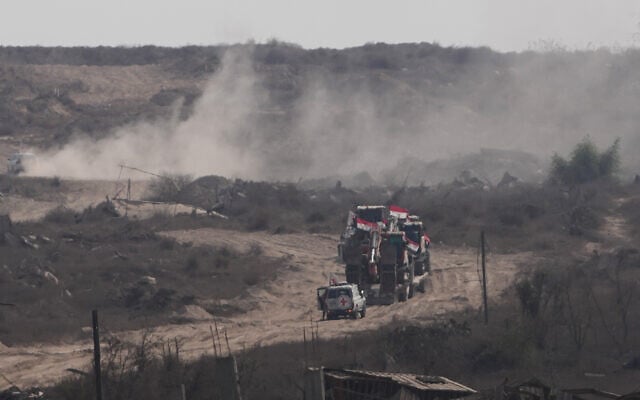 Members of the International Committee of the Red Cross (ICRC) and Egyptian workers head to east of Gaza City to search for the bodies of hostages, Nov. 12, 2025. (AP Photo/Jehand Alshrafi)