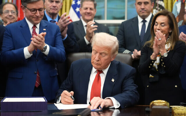 US President Donald Trump signs the funding bill to reopen the government, in the Oval Office of the White House in Washington, November 12, 2025. (Jacquelyn Martin/AP) US President Donald Trump signs the funding bill to reopen the government, in the Oval Office of the White House in Washington, November 12, 2025. (Jacquelyn Martin/AP)