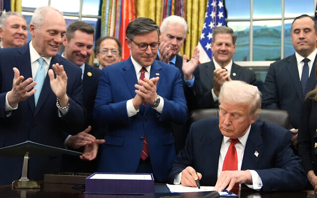 As Congressional leaders applaud, US President Donald Trump signs the funding bill to reopen the government, in the Oval Office of the White House, November 12, 2025, in Washington. (AP/Jacquelyn Martin) As Congressional leaders applaud, US President Donald Trump signs the funding bill to reopen the government, in the Oval Office of the White House, November 12, 2025, in Washington. (AP/Jacquelyn Martin)