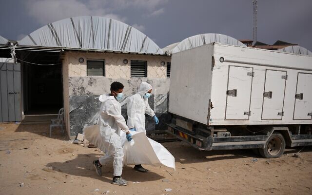 Bodies of unidentified Palestinians returned from Israel as part of the ceasefire deal are carried in Nasser Hospital in Khan Younis, Gaza Strip, Friday, Nov. 14, 2025. (AP Photo/Abdel Kareem Hana) Bodies of unidentified Palestinians returned from Israel as part of the ceasefire deal are carried in Nasser Hospital in Khan Younis, Gaza Strip, Friday, Nov. 14, 2025. (AP Photo/Abdel Kareem Hana)