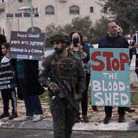Palestinian and Israeli activists take part in a protest against settler violence as they gather in the West Bank town of Beit Jala, Nov. 14, 2025. (AP/Mahmoud Illean)