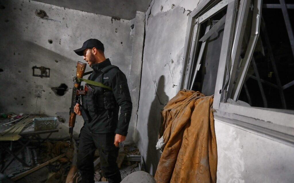 A Syrian Internal Security Forces officer inspects a home in Damascus, Syria, Nov. 14, 2025, after it was hit by rockets, according to state media (AP Photo/Omar Sanadiki)