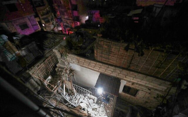 A TV crew films at a home in Damascus, Syria, November 14, 2025, after it was hit by rockets, according to state media. (AP Photo/Omar Sanadiki)