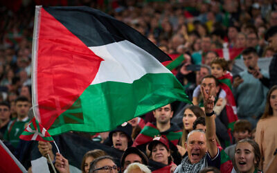 Fans wave Palestinian flags during a friendly match between a selection of Palestinian players and a group of Spanish players from the Basque Country, held to protest against Israel amid the war in Gaza, in Bilbao, Spain, November 15, 2025. (AP Photo/Miguel Oses) Fans wave Palestinian flags during a friendly match between a selection of Palestinian players and a group of Spanish players from the Basque Country, held to protest against Israel amid the war in Gaza, in Bilbao, Spain, November 15, 2025. (AP Photo/Miguel Oses)