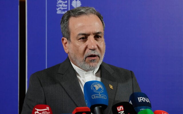 Iranian Foreign Minister Abbas Araghchi speaks in a news briefing after attending a conference titled "International Law Under Assault: Aggression and Self-Defense," in Tehran, Iran, November 16, 2025. (AP Photo/Vahid Salemi)