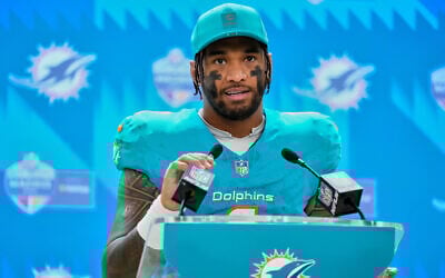Miami Dolphins quarterback Tua Tagovailoa attends a press conference after an NFL football game between the Washington Commanders and the Miami Dolphins in Madrid, Spain, November 16, 2025. (AP Photo/Manu Fernandez)