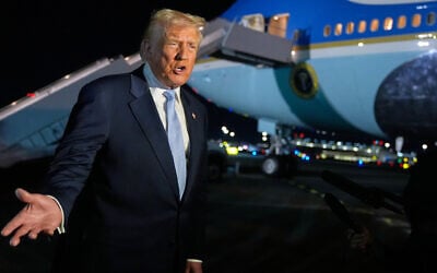 US President Donald Trump speaks to reporters before boarding Air Force One at Palm Beach International Airport in West Palm Beach Florida, on his way back to the White House, November 16, 2025. (AP Photo/Manuel Balce Ceneta)