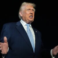 US President Donald Trump speaks to reporters before boarding Air Force One at Palm Beach International Airport in West Palm Beach, Florida, on his way back to the White House, November 16, 2025. (AP Photo/Manuel Balce Ceneta)