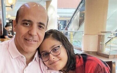 This 2023 photo provided by Safiah Mohammed shows Dr. Ali Almudhwahi, left, with his daughter, Youmna. (Safiah Mohammed via AP)