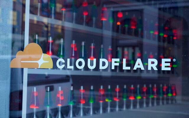 FILE - Lava lamps are seen through a lobby window at the headquarters of Cloudflare in San Francisco, August 31, 2022. (AP Photo/Eric Risberg, File) FILE - Lava lamps are seen through a lobby window at the headquarters of Cloudflare in San Francisco, August 31, 2022. (AP Photo/Eric Risberg, File)