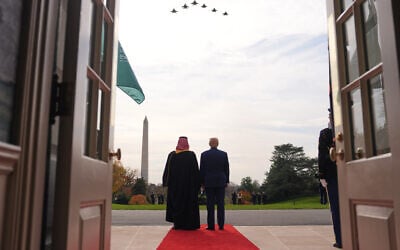 US President Donald Trump (right) and Saudi Arabia's Crown Prince Mohammed bin Salman watch F-35s and F-15s fly over during a welcome ceremony on the South Lawn of the White House, November 18, 2025, in Washington. (AP/Evan Vucci)