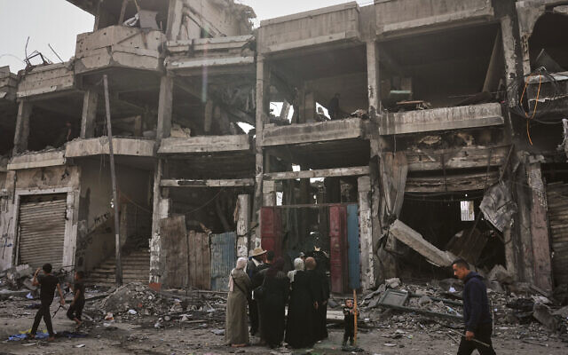 Palestinians inspect the aftermath of an Israeli strike on a building in Gaza City, a day after the strike, on November 20, 2025. (AP Photo/Jehad Alshrafi) Palestinians inspect the aftermath of an Israeli strike on a building in Gaza City, a day after the strike, on November 20, 2025. (AP Photo/Jehad Alshrafi)