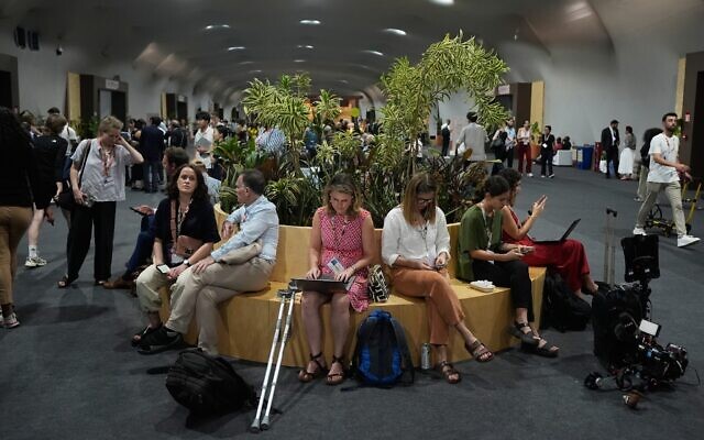 Attendees work as negotiations continue at the COP30 UN Climate Summit in Belem, Brazil, November 21, 2025. (AP Photo/Fernando Llano) Attendees work as negotiations continue at the COP30 UN Climate Summit in Belem, Brazil, November 21, 2025. (AP Photo/Fernando Llano)