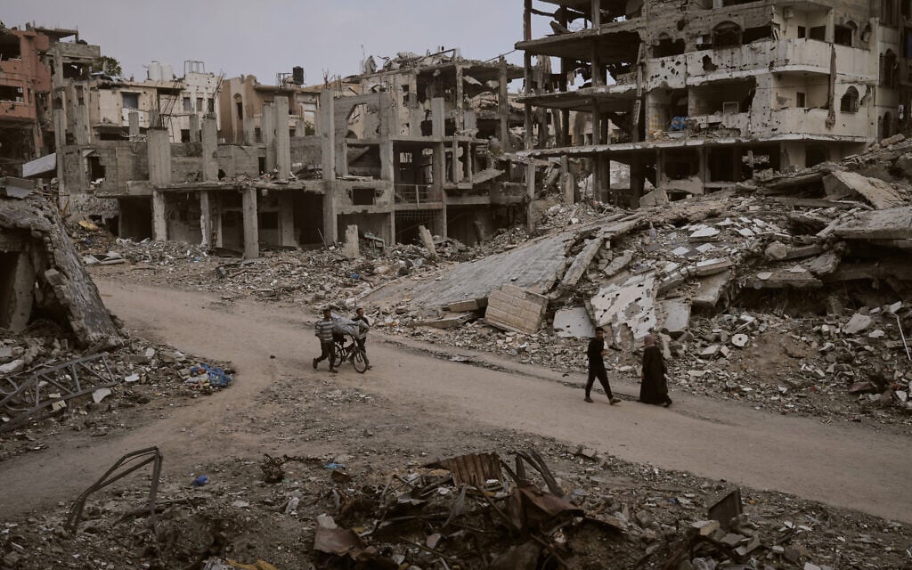 Palestinians walk among the ruins of destroyed buildings in Gaza City, Nov. 24, 2025. (AP Photo/Jehad Alshrafi) Palestinians walk among the ruins of destroyed buildings in Gaza City, Nov. 24, 2025. (AP Photo/Jehad Alshrafi)