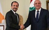 Lebanese President Joseph Aoun, right, shakes hands with his Cypriot counterpart Nikos Chistodoulides after a joint press conference, at the presidential palace in Baabda east of Beirut, Lebanon, November 26, 2025. (AP Photo/Hussein Malla)