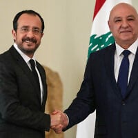Lebanese President Joseph Aoun, right, shakes hands with his Cypriot counterpart Nikos Chistodoulides after a joint press conference, at the presidential palace in Baabda east of Beirut, Lebanon, November 26, 2025. (AP Photo/Hussein Malla)
