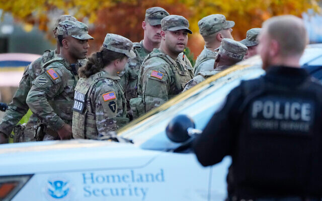 Members of the National Guard gather after reports of two National Guard soldiers were shot near the White House in Washington, November 26, 2025. (Mark Schiefelbein/AP) Members of the National Guard gather after reports of two National Guard soldiers were shot near the White House in Washington, November 26, 2025. (Mark Schiefelbein/AP)