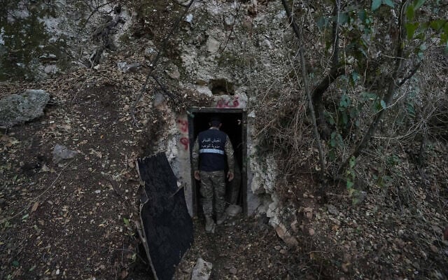 A Lebanese army soldier stands at the entrance of a tunnel dug into a mountain that was used by Hezbollah as a clinic and storage facility near the Lebanese-Israeli border in the Zibqin Valley, southern Lebanon, Friday, Nov. 28, 2025. (AP Photo/Bilal Hussein)