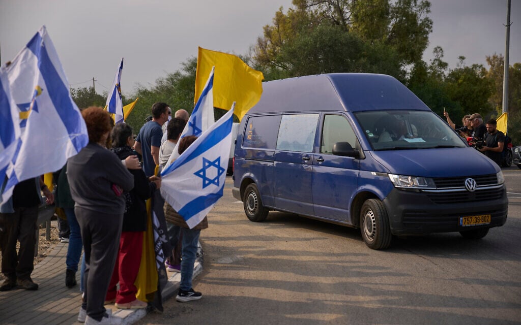 Mourners wave Israeli flags as the convoy carries the coffin of slain Israeli slain hostage Dror Or, Nov. 30, 2025. (AP Photo/Ohad Zwigenberg) Mourners wave Israeli flags as the convoy carries the coffin of slain Israeli slain hostage Dror Or, Nov. 30, 2025. (AP Photo/Ohad Zwigenberg)