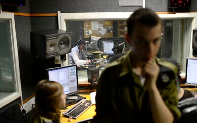 Radio broadcasters seen in the offices of Army Radio, the national IDF radio station, in Jaffa, March 27, 2014. (Tomer Neuberg/Flash 90)