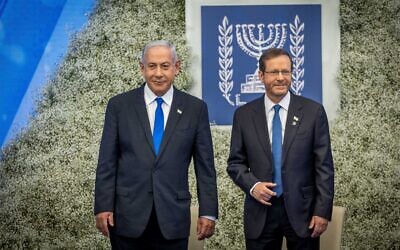 Prime Minister Benjamin Netanybahu (L) and President Isaac Herzog at event for outstanding soldiers as part of Israel's 75th Independence Day celebrations, at the President's Residence in Jerusalem on April 26, 2023 (Yonatan Sindel/Flash90)