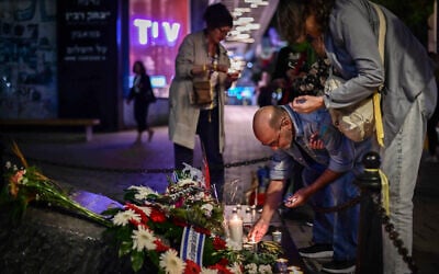 People visit the monument site for assassinated prime minister Yitzhak Rabin, at Rabin Square in Tel Aviv on November 4, 2024. (Tomer Neuberg/Flash90)