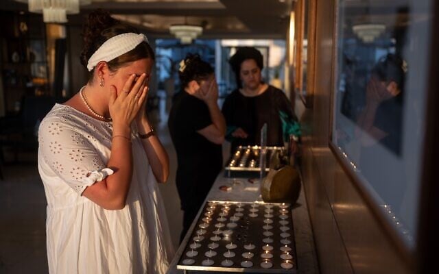Women light Shabbat candles, in Tel Aviv, on June 20, 2025. (Chaim Goldberg/FLASH90)