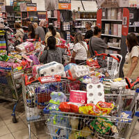 People buying food ahead of Rosh Hashanah in Jerusalem on September 16, 2025 (Rachel Alroey/Flash90)