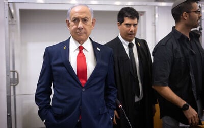 Illustrative: Prime Minister Benjamin Netanyahu arrives at the courtroom of the Tel Aviv District Court in the trial against him, October 28, 2025. (Miriam Alster/Flash90)