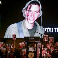 An image of slain captive Lt. Hadar Goldin is shown on the screen during a protest at Hostages Square in Tel Aviv calling for the release of the remaining hostages held by Hamas, November 8, 2025. (Avshalom Sassoni/Flash90)