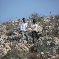 Jewish settlers attack Palestinians during the olive-picking season in the village of Beita, south of Nablus in the West Bank, November 8, 2025. (Nasser Ishtayeh/Flash90)