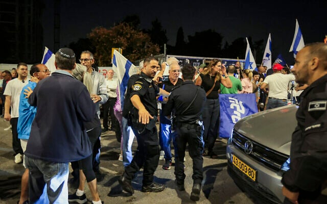 Protesters demonstrate outside the home of former IDF military advocate general Maj. Gen. Yifat Tomer-Yerushalmi, in Ramat Hasharon, October 8, 2025. (Tal Gal/Flash90) Protesters demonstrate outside the home of former IDF military advocate general Maj. Gen. Yifat Tomer-Yerushalmi, in Ramat Hasharon, October 8, 2025. (Tal Gal/Flash90)