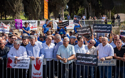 Members of the Arab community protest against the violence in their community outside the Prime Minister's Office in Jerusalem, November 9, 2025 (Yonatan Sindel/ Flash90) Members of the Arab community protest against the violence in their community outside the Prime Minister's Office in Jerusalem, November 9, 2025 (Yonatan Sindel/ Flash90)