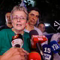 Leah and Simcha Goldin, parents of fallen soldier Hadar Goldin, offer a statement after the return of their son's body from Hamas captivity in Gaza, outside their Kfar Saba home on November 9, 2025 (Yehoshua Yosef/Flash90)