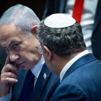 Prime Minister Benjamin Netanyahu speaks with National Security Minister Itamar Ben Gvir during a '40-signature' debate at the Knesset in Jerusalem, on November 10, 2025. (Yonatan Sindel/Flash90)
