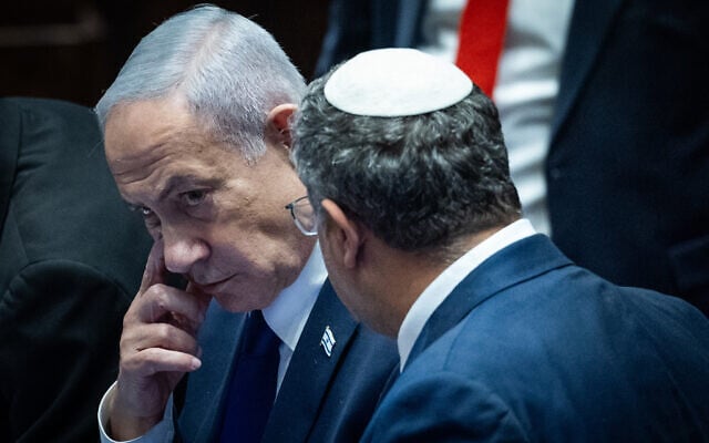 Prime Minister Benjamin Netanyahu speaks with National Security Minister Itamar Ben Gvir during a '40-signature' debate at the Knesset in Jerusalem, on November 10, 2025. (Yonatan Sindel/Flash90)