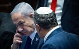 Prime Minister Benjamin Netanyahu speaks with National Security Minister Itamar Ben Gvir during a '40-signature' debate at the Knesset in Jerusalem, on November 10, 2025. (Yonatan Sindel/Flash90)