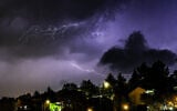 Lightning illuminates the sky over the Upper Galilee, during a storm on November 13, 2025. (Ayal Margolin/Flash90)