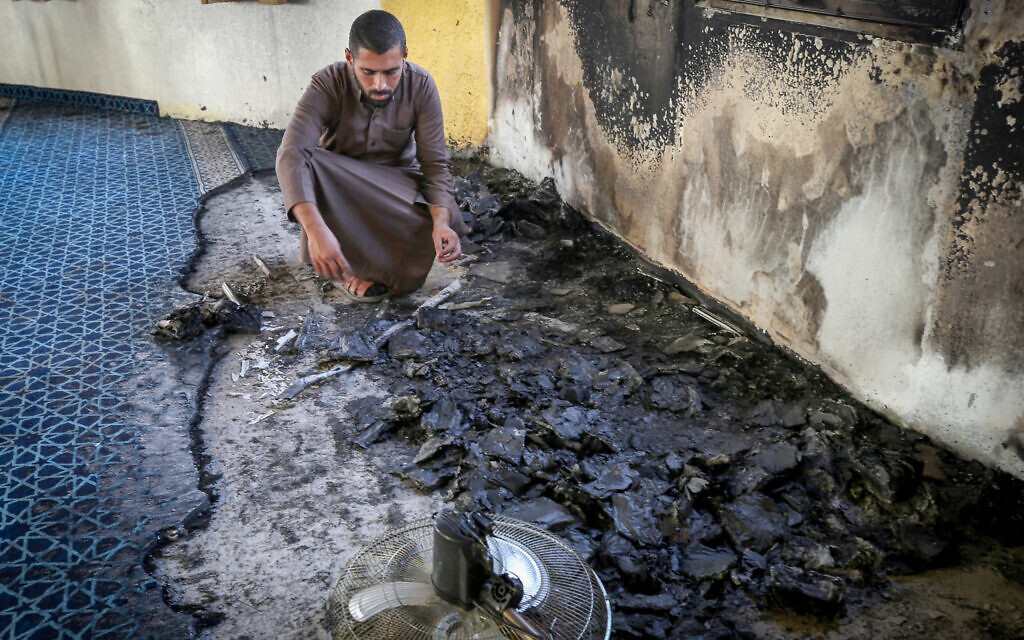 A Palestinian inspects a mosque in Deir Istiya after it was said to have been set on fire by Israeli settlers, on November 13, 2025. (Nasser Ishtayeh/Flash90) A Palestinian inspects a mosque in Deir Istiya after it was said to have been set on fire by Israeli settlers, on November 13, 2025. (Nasser Ishtayeh/Flash90)