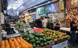 Illustrative: Shoppers at the Mahane Yehuda market in Jerusalem, November 13, 2025. (Nati Shohat/FLASH90)