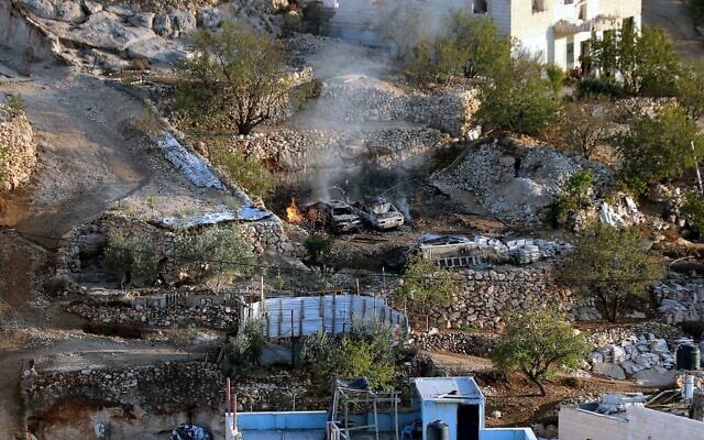 A house and two vehicles belonging to Palestinians burn after a reported attack by Jewish extremists in Sa'ir, north of Hebron in the West Bank, November 17, 2025. (Wisam Hashlamoun/Flash90)