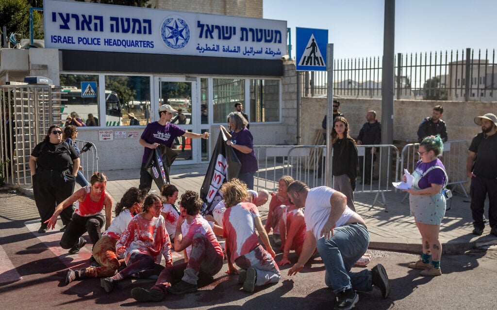 Members of the ‘Standing Together’ movement protest outside Israel’s national police headquarters in Jerusalem against rising violence in Arab communities in Israel, November 23, 2025. (Chaim Goldberg/Flash90) Members of the ‘Standing Together’ movement protest outside Israel’s national police headquarters in Jerusalem against rising violence in Arab communities in Israel, November 23, 2025. (Chaim Goldberg/Flash90)